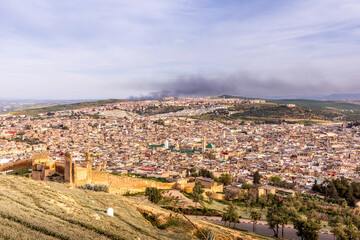 Fototapeta na wymiar Fez, Morocco - March 17, 2024: Panoramic view of the medina of Fez from Borj Nord in Morocco