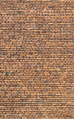 Closeup of old weathered brown brick wall texture