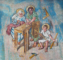 MILAN, ITALY - MARCH 4, 2024: The mosaic of Holy Family in the church Chiesa di Santa Rita da Cascia designed by pater P.Leo Coppens and made by G.B.Salerno (1960-65).