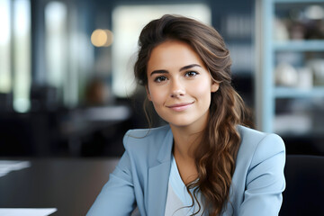 Obraz premium portrait of a beautiful young business woman in an office room. success in business and study