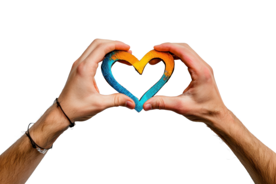 Hands gently cradling a heart-shaped piece of wood, painted in vibrant hues of blue and orange.