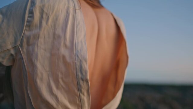 Naked back woman dancing at nature closeup. Young girl dancer body improvising