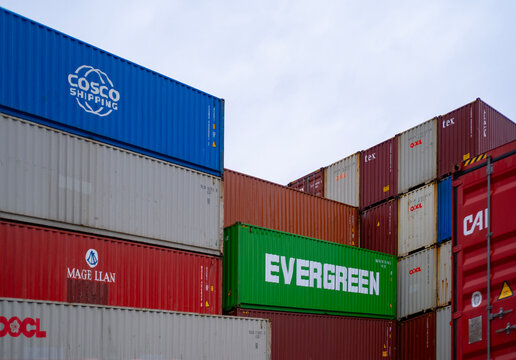Evergreen Marine Corporation, COSCO, OOCL Shipping containers largest shipping and logistics company stacked in port, Logistics and supply chain management, Frankfurt, Germany - January 21, 2024