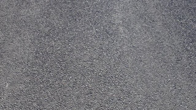 High-resolution image showcasing the detailed texture of an asphalt road surface