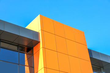 abstract image orange metal wall against the blue sky - 767456863