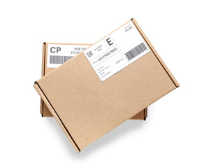 Cardboard packages with shipping labels and barcodes on white background