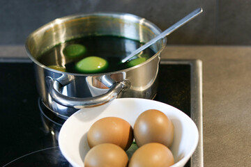 Coloring easter eggs with natural herb curcuma at home