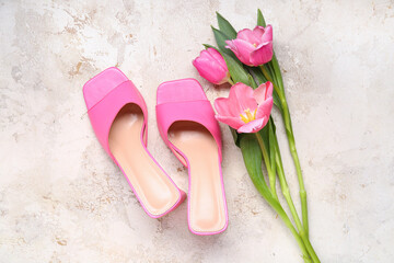 Female shoes with tulip flowers on brown grunge background