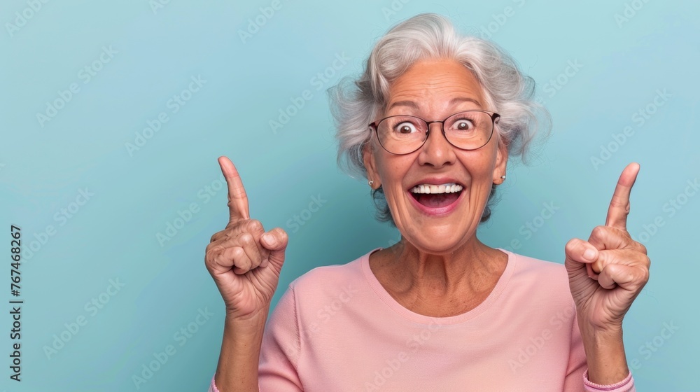 Poster elderly man pointing enthusiastically on soft pastel backdrop with space for text