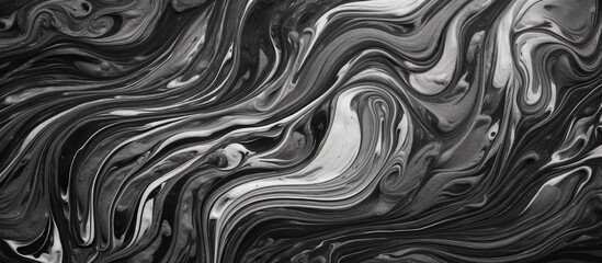 A monochrome photograph captures the intricate patterns of a marble texture in shades of brown and grey, creating a visual art piece with liquidlike symmetry