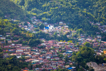 Settlement in one part of Jayapura City. Jayapura is the capital of Papua Province in Indonesia. This housing complex is sandwiched between hills and mountains.