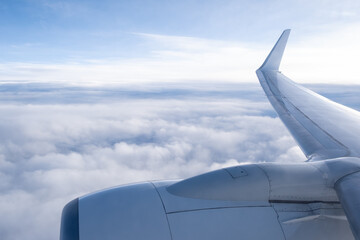 Concept Detail of military drone,Unmanned Aerial Vehicle (UAV) flying over clouds. An airplane wing...