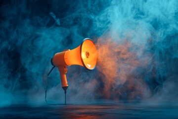 Dramatic Illuminated Orange Megaphone on Stand with Blue Smoke in Dark Background Conceptual Photography - obrazy, fototapety, plakaty
