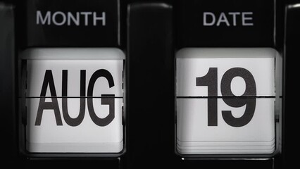 retro flip calendar with a date change from the eighteenth of August to the nineteenth of August. daily calendar with a change of days of the month. close up.