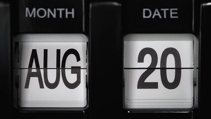 retro flip calendar with a date change from the nineteenth of August to the twentieth of August. daily calendar with a change of days of the month. close up.