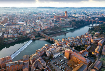 Panoramic view from drone of city of Albi, Cathedral Basilica of Saint Cecilia and Pont Vieux over river Tarn - obrazy, fototapety, plakaty