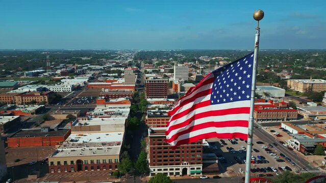 Panning Shot of Waco Texas Skyline and US Flag
