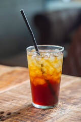 Refreshing Iced Coffee Beverage with Straw on Wooden Table