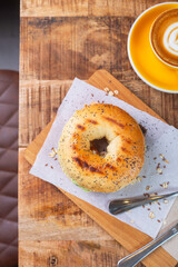 Gourmet Bagel and Cappuccino Breakfast in Cozy Cafe Setting