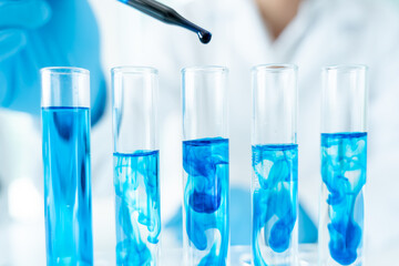 Scientist analyze biochemical samples in advanced scientific laboratory. Medical professional use...