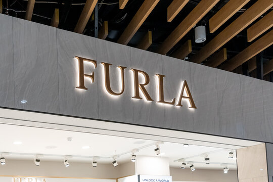 Auckland,  New Zealand - February 23, 2024: Close up of Furla store sign is seen. Auckland,  New Zealand. Furla produces bags, shoes, and small leather goods.