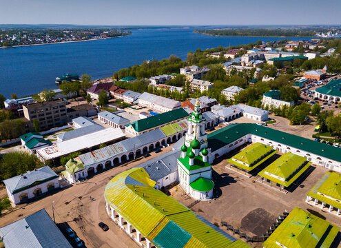 Scenic view from drone of Kostroma cityscape on bank of Volga River with complex of provincial trading arcades (Gostiny Dvor), Russia..