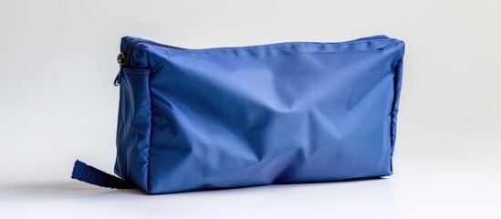 Blue cosmetic bag seen from the side, isolated against a white background.