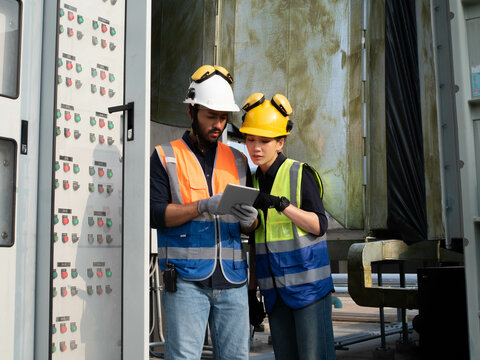 Female woman lady male man boy gentle man person people human yellow white hardhat helmet teamwork colleague labor day contractor development professional cooperation leadership tablet architecture