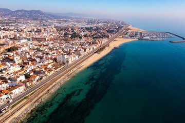 Bird's eye view of coastal town Premia de Mar in comarca of Maresme, Catalonia, Spain. - obrazy, fototapety, plakaty