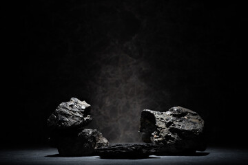 podium with stones with texture on a dark background