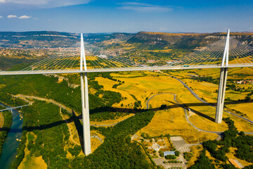 Drone view of cable-stayed Millau Viaduct, highest road bridge in Europe, spanning Tarn River...