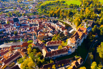 View from drone of historical houses of Czech city Cesky Krumlov in sunny fall day