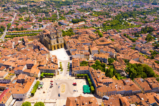Aerial view of Auch cityscape overlooking medieval Gothic building of Sainte-Marie Cathedral on summer day, France