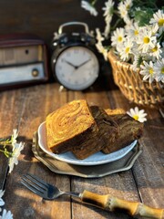 Homemade round sponge cake or chiffon cake on white plate so soft and delicious with ingredients:...