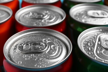 Energy drinks in wet cans, closeup. Functional beverage