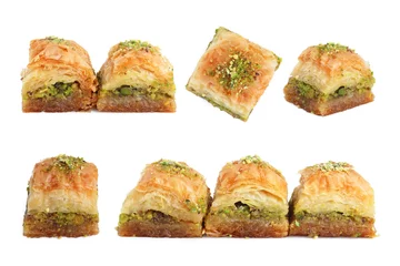  Eastern sweets. Pieces of delicious fresh baklava with chopped nuts isolated on white, set © New Africa