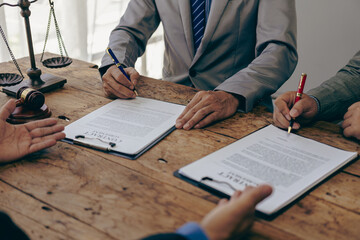 Lawyer and justice concept Discussion between male lawyer and client, giving advice and proceeding with financial legal matters. Close-up image.