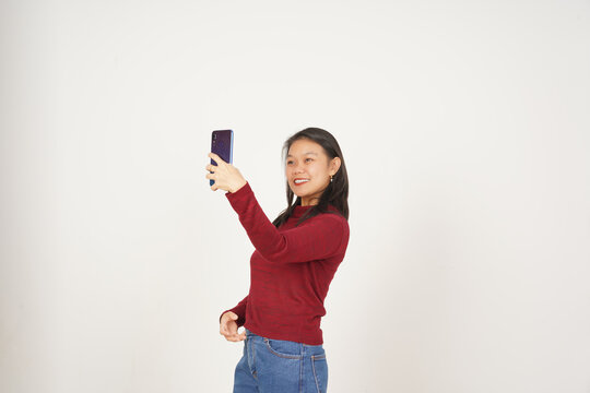 Young Asian woman in Red t-shirt Take a Selfie photo isolated on white background