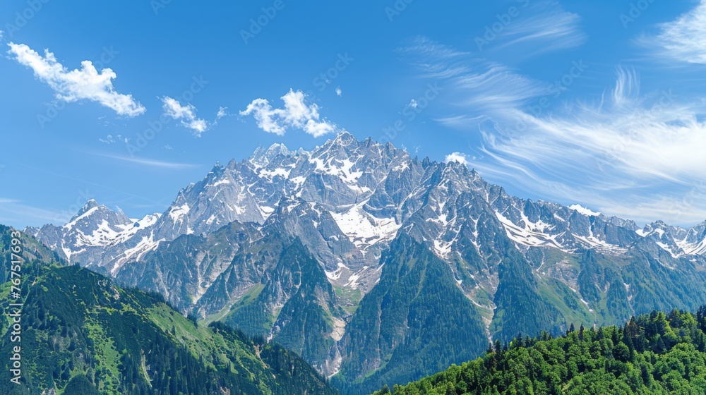 Poster a view of a mountain range with trees in the foreground and a blue sky with clouds in the background