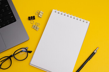 Yearly Planning, Notebook and Pencil with Business Supplies on Yellow Background