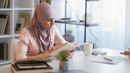 Intern education book study woman reading office