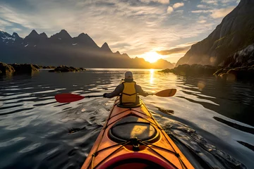 Zelfklevend Fotobehang tourist floats on a yellow kayak along a river in the fjords of Norway. water sports and boat travel © photosaint