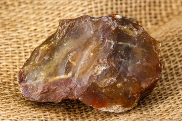 Stone scraper made of red-yellow chalcedony, Stone Age tool