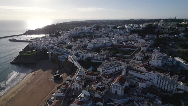 Aerial pushback of beautiful Albufeira town by the Atlantic Ocean in the morning, Algarve