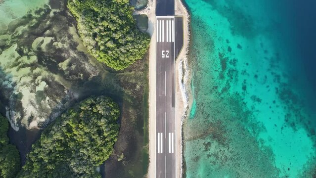An airstrip on great roque, los roques with clear turquoise waters, aerial view