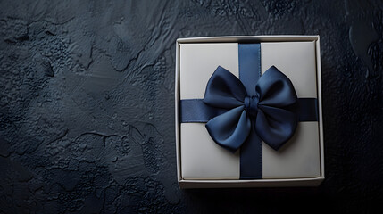 Gift father day. Blue bowtie or tie, white box with bow ribbon on dark background. Happy loving family and Fathers Day concept. copy space.