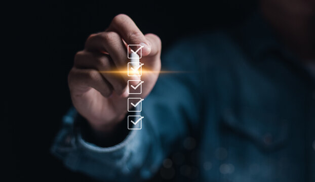 Checklist concept. Businessman tick correct mark on checkboxes for approve document.