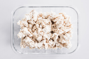 tofu chunks in glass container, close-up shot
