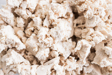 tofu chunks in glass container, close-up shot