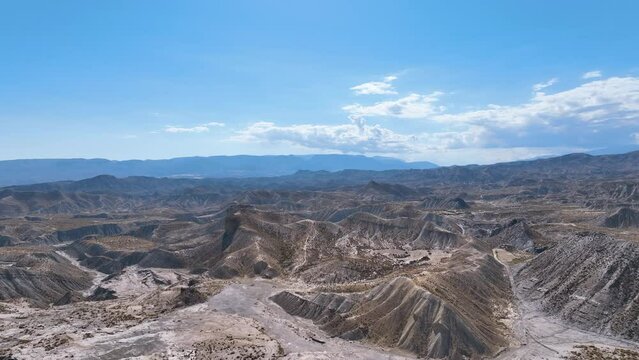 Aerial above the dried up riverbeds and steep valleys of Tabernas desert